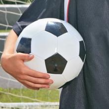 Soccerball under an arm